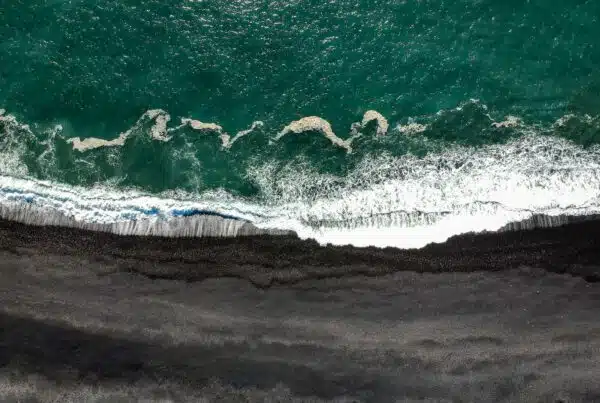 Blog 2 aerial photography of waves crashing on cliff at daytime